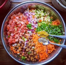 Load image into Gallery viewer, Healthy salad being dressed with SpiceFix Coriander Powder and crushed Tellicherry Black Peppercorns
