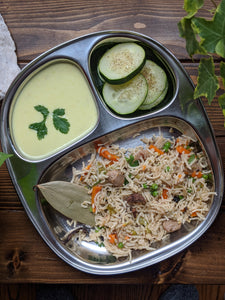 Plate pulav / pilaf with cucumber salad and kadhi