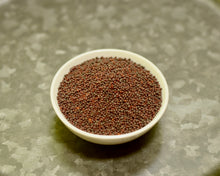 Load image into Gallery viewer, A bowl of small variety black mustard seeds
