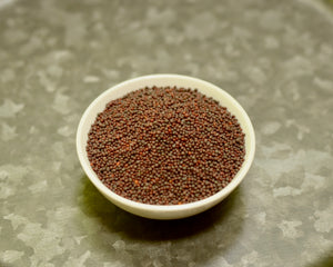 A bowl of small variety black mustard seeds