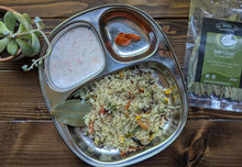 Load image into Gallery viewer, Plate pulav / pilaf with cucumber salad and raita
