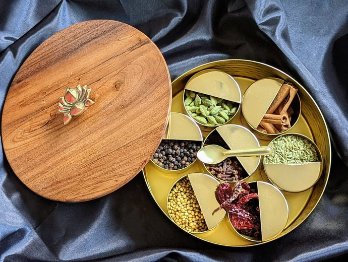 SpiceFix masala dabba on display with spices stored inside. Open wooden lid displayed 