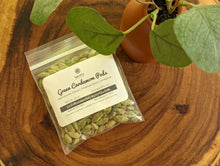 Load image into Gallery viewer, SpiceFix premium Idukki whole green cardamom pods, pack of 1.8 oz on display
